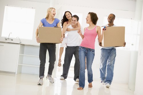 Removal team planning a house move on a Bowespark residential street