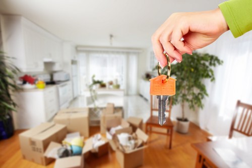 Careful unloading of boxes and furniture at a new Bowespark home