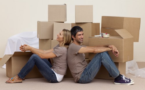 Packed boxes and furniture ready for a local removal service
