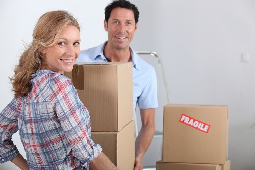 Careful removal of large household furniture from a narrow stairwell