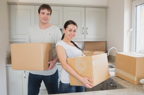 Packed moving boxes and furniture prepared for a Bowespark home removal